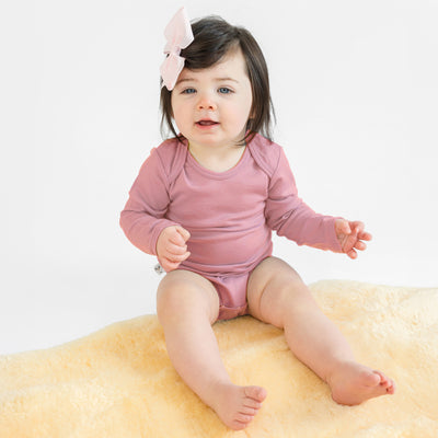 bodysuit in Blush on a baby model